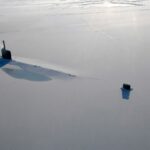 broken Arctic sea ice floating on cold ocean water